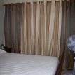 Bedroom with AC unit and ample wall closet